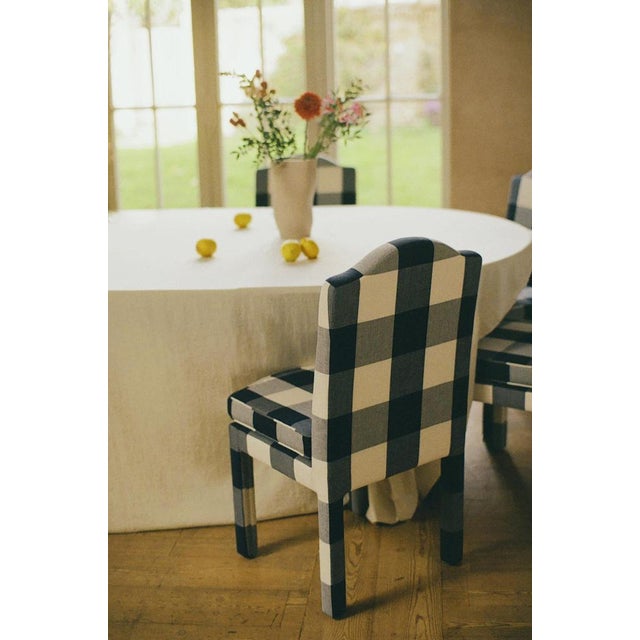 Our fully upholstered dining chair is a super chic addition to any dining table, and can sit just as well as a side or...