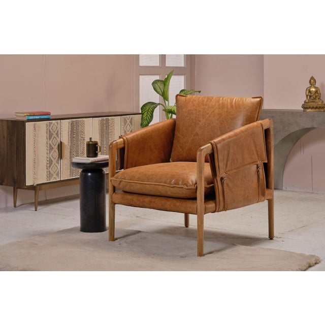 The Hadlow brown leather accent chair brings genuine leather upholstery and solid wood construction into spaces that value...