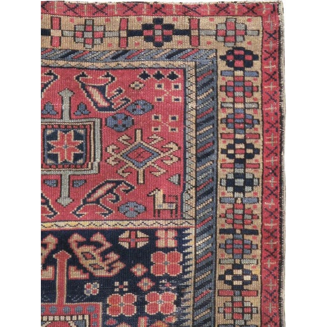 This mid-20th-century Turkish Anatolian throw rug presents a compact, panelled composition framed by multiple geometric...