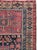 This mid-20th-century Turkish Anatolian throw rug presents a compact, panelled composition framed by multiple geometric...