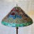 Vintage floor lamp with champleve enamel inlaid bronze base and standard and lovely leaded glass shade with multi-colored...