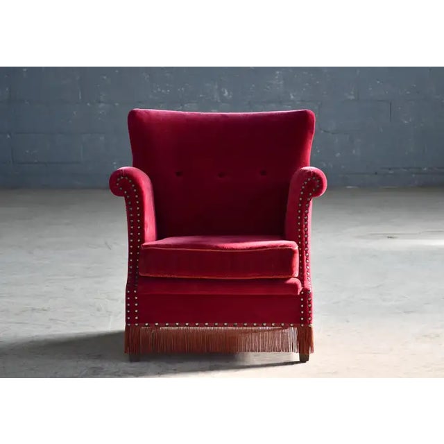 Charming and very elegant Classic Danish highback lounge chair in the style of Peter Hvidt and Orla Molgaard. Made around...