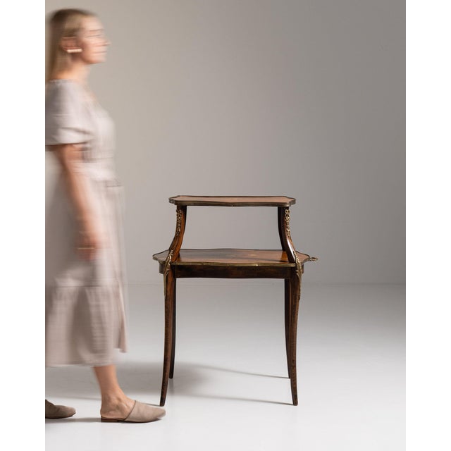 Two-tier walnut side table in Rich Walnut Brown. Finished in rich walnut brown, this two-tier walnut side table is...