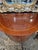 Supremely elegant glossy mahogany cabinet credenza by Kindel having demilune shape and storage inside. Ormulu decoration...