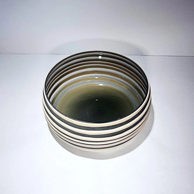 Beautiful Vessel Bowl by Viterra Art Glass measures 9 x 9 x 4 inches. The bowl is of the Viterra Gallery Collection, and...