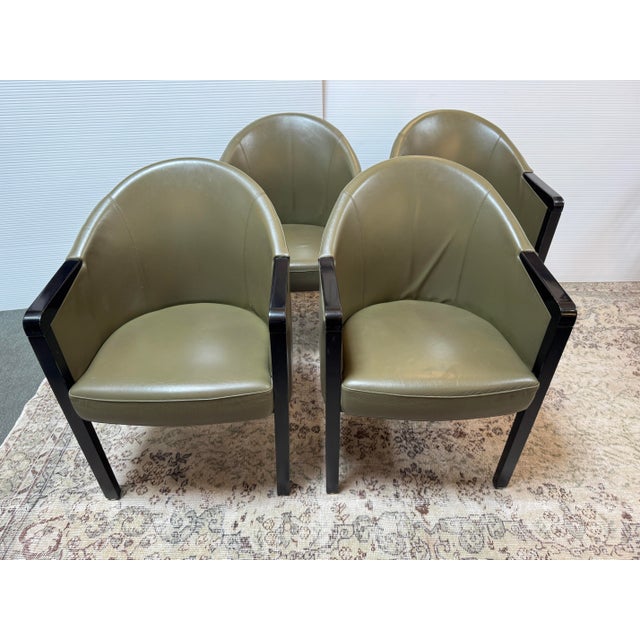 Design Plus Gallery presents a Set of Four Late 20th Century Leather Armchairs by Poltrona Frau. The chairs offer solid...
