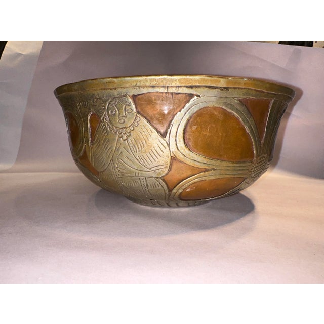 This listing is for a mid century Indo Persian bowl. The bowl is hand hammered metal with 2 tone metalwork. This bowl is...