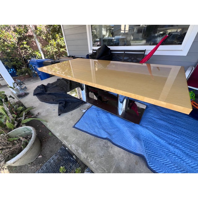 Fendi Casa Bernini Dining Table. Tabletop is wood with an epoxy coating and the base is chrome. Has some minor scratches...