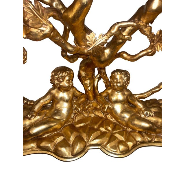 An exceptional and rare Italian early 19th century giltwood mirror and console ensemble, originating from Tuscany and...