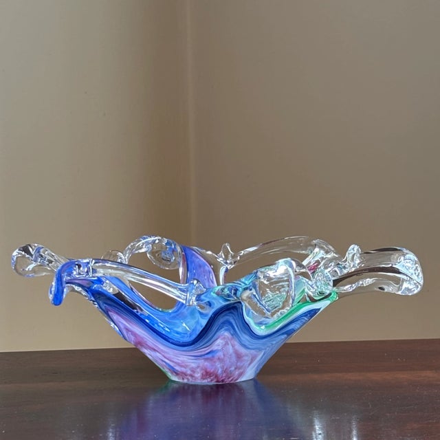 An exquisite late-20th century free form Murano art glass bowl. Incredible, swirling designs in royal blue, pink and...