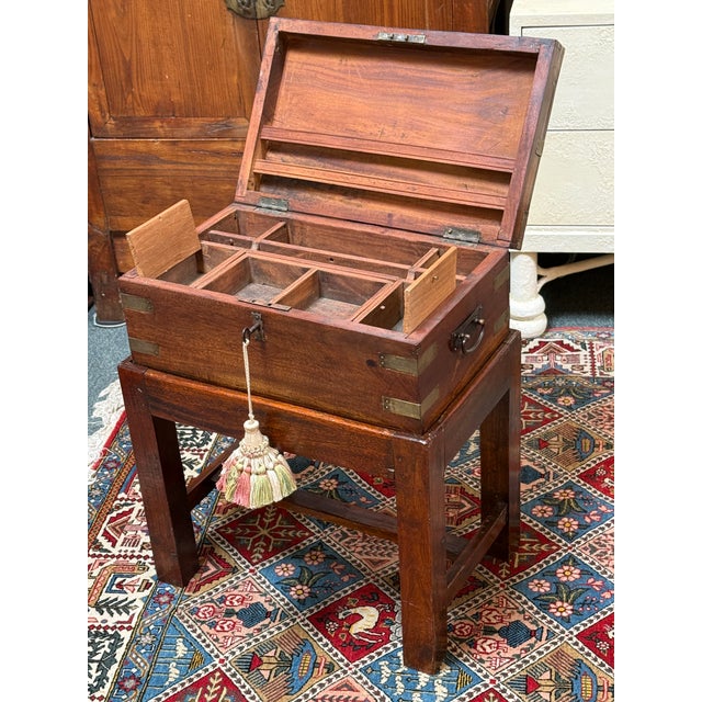 Design Plus Gallery presents an Antique Lap Desk in the Campaign Style. The desk is a portable, fold-out wooden writing...