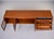 This mid-century teak sideboard by Younger is a study in British modernist design, blending architectural interest with...