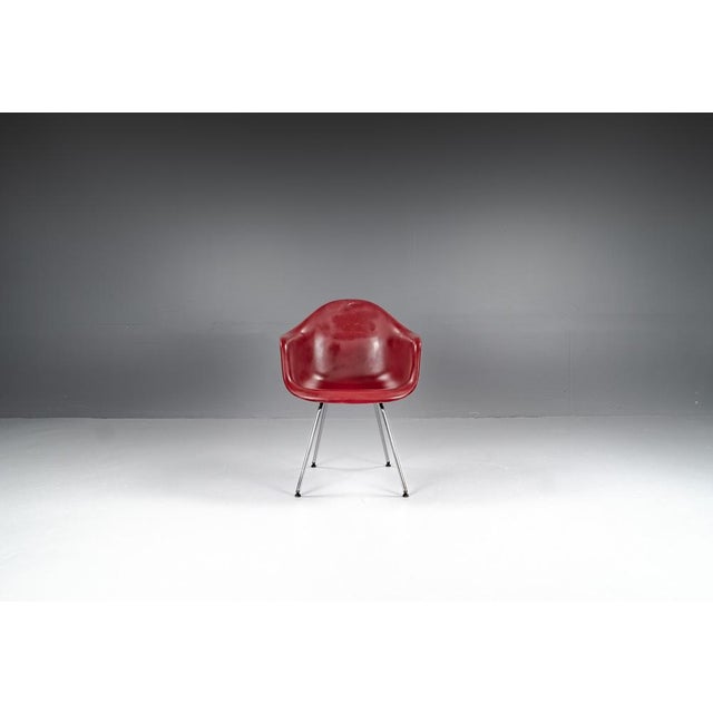 Dax armchair designed by Charles & Ray Eames for Herman Miller, 1950s. The seat shell in fiberglass, with a steel base...
