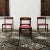 - Set of 4 dining chairs designed by Gianfranco Frattini in the 1960s - Structure in brown beech - Seat in red Skai faux...