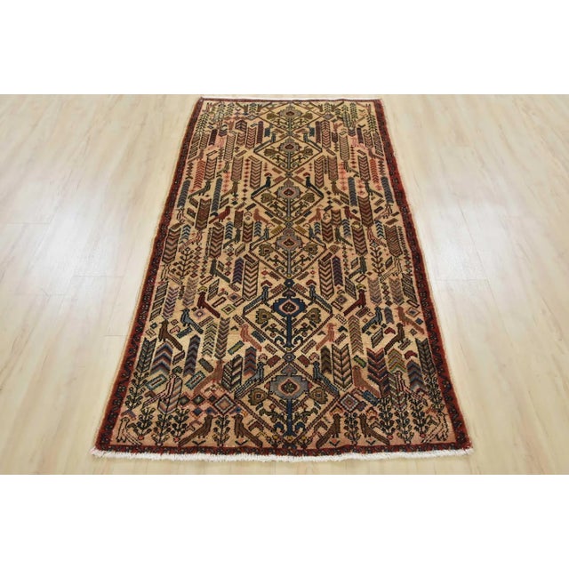 An authentic semi-antique tribal Hamedan rug hand-knotted with fine wool and natural dyes. This nomadic oriental rug...