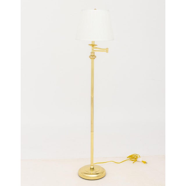 Pair of Modern Polished Brass Adjustable Floor Lamps, each with articulated arm and white pleated shade. Most compact...