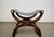 Vintage Hollywood Regency leather saddle stool for sale. It's a very unique saddle bench with a sling leather seat, and...