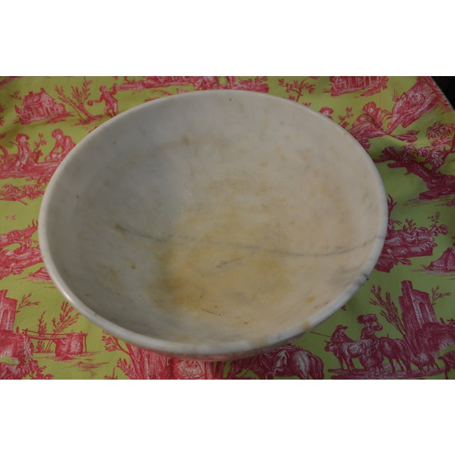 What a great marble bowl! An awesome centerpiece for the holidays/home decor. It is heavy, 15 lbs 6 oz un packed, & solid....