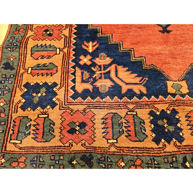Mid 20th Century Vintage Kurdish Tribal Rug With Medallion Design in Red, Green & Saffron For Sale - Image 5 of 18