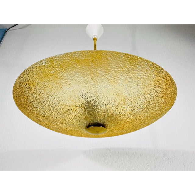 Mid-Century Modern pendant lamp attributed to Boris Lacroix made in the 1960s. The shade is made of acrylic glass and the...