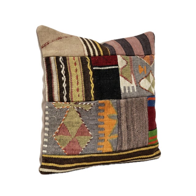 This beautiful 19'' x 20'' pillow cover was made from authentic Turkish Kilim pieces. Bright colors of wool adorn the...