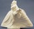 Sculpture, figurine in fine porcelain, blanc de china, depicting a lady in 18th-century dress with a full crinoline skirt,...