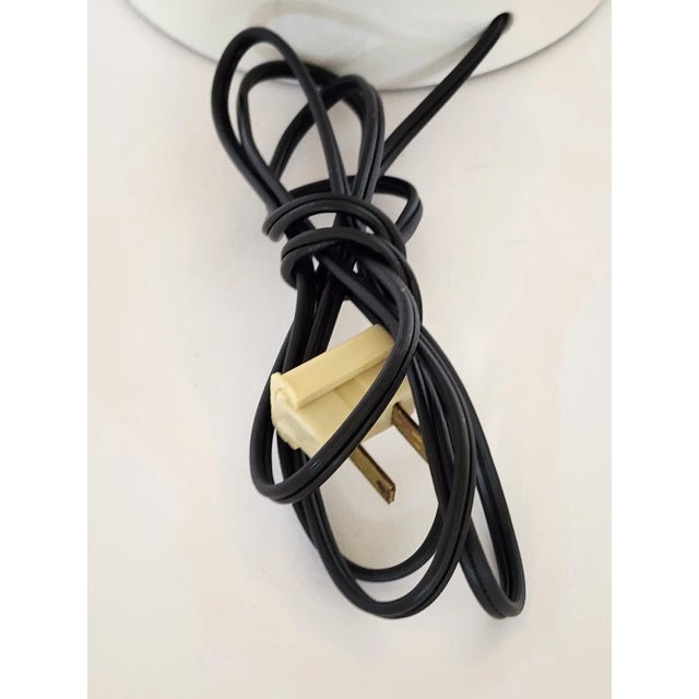 Vintage Mid-Century tall white ceramic table lamp featuring handpainted Asian calligraphy or Chinese characters. The black...