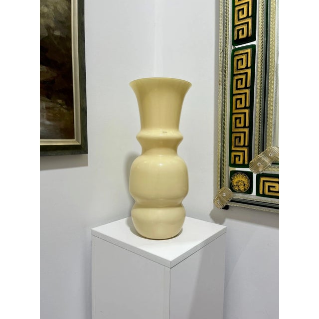 This large vase was made by one of Murano's most famous houses of glass, Venini. Lovely neutral ivory coloring. Signed and...
