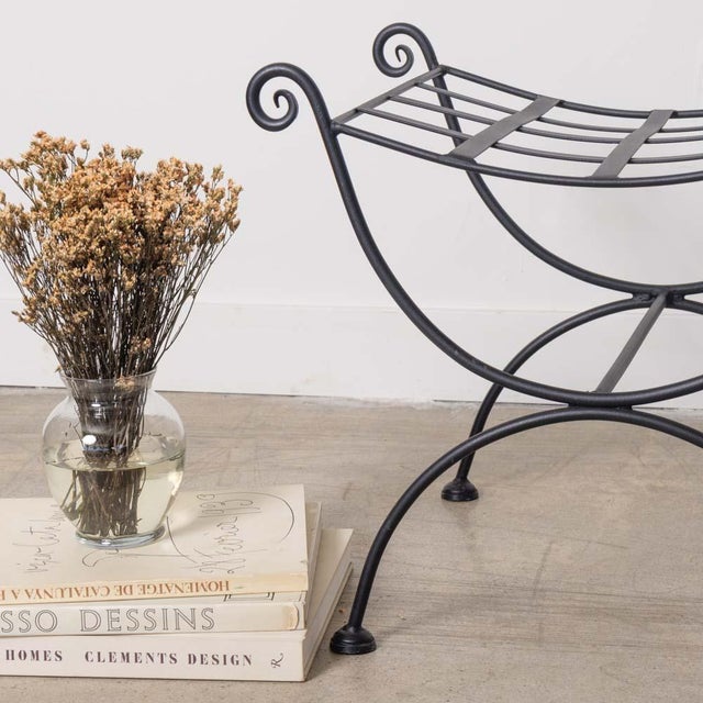 Lovely pair of curule iron stools from France, 1920s. Curvy wrought iron body with loop detail. Seat ready to be...