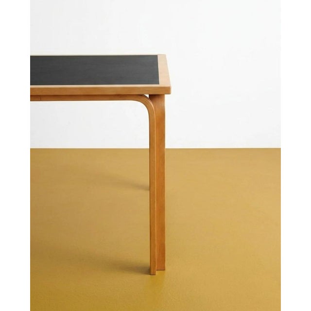 Vintage magnus olesen table, perfect for mid-century modern decor and offices. This 1950s danish table with a two-tone top...