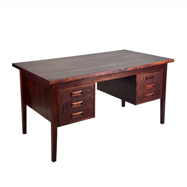 Vintage executive-style desk in Brazilian rosewood, complete with six drawers with unique inset drawer pulls, gently...
