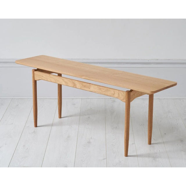 The Hideout&nbsp;bench features elegant floating rails, and a slender shadow gap running centrally along seat with subtle...