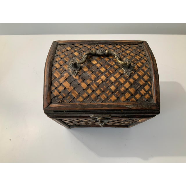 Woven vintage chinoiserie rattan and bamboo box with brass handle and latch. This is a sturdy and well sized box for...