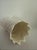This vintage Belleek "Lily of the Valley" 6 1/2 inch vase is a charming piece of Irish porcelain craftsmanship from the...
