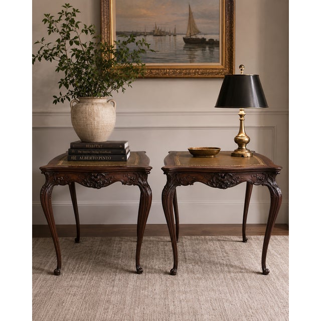 A refined pair of antique French Louis XV–style side tables, imported from France and crafted in solid mahogany. Each...