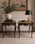 A refined pair of antique French Louis XV–style side tables, imported from France and crafted in solid mahogany. Each...