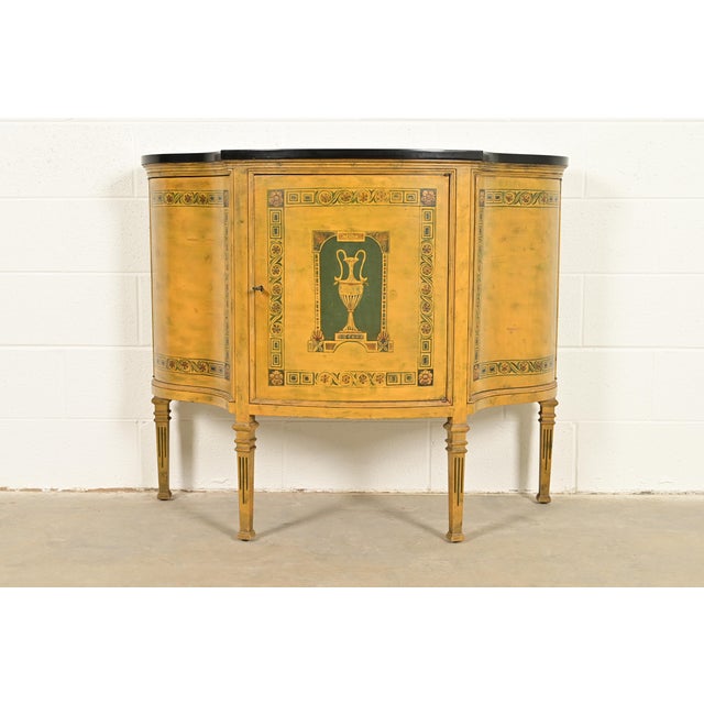 A gorgeous Italian Neoclassical or Louis XVI style demilune console or bar cabinet Italy, Circa Mid-20th Century Paint...