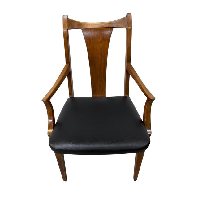 A stunning set of six Mid-Century Modern walnut dining chairs, dating to the 1960s. This beautifully designed collection...