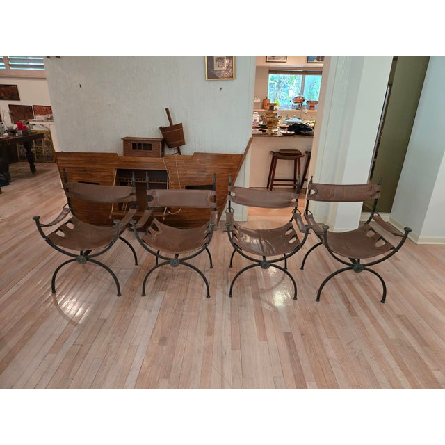 Mid Century Wrought Iron and Brass Savonarola Chairs sold as found showing oxidation to metal butin good structural...