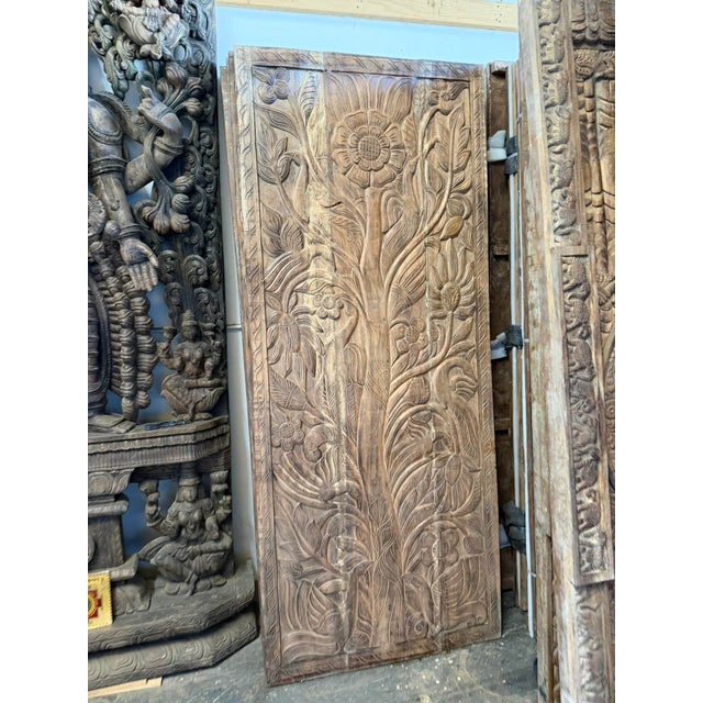 Bring warmth and character to your space with this beautifully hand-carved wood door panel featuring an intricate...