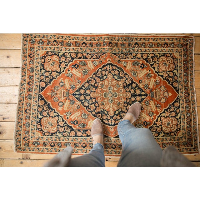 :: Antique circa 1915 Persian Tabriz rug with center medallion and floral motif. A pale rusty orange and deep navy...
