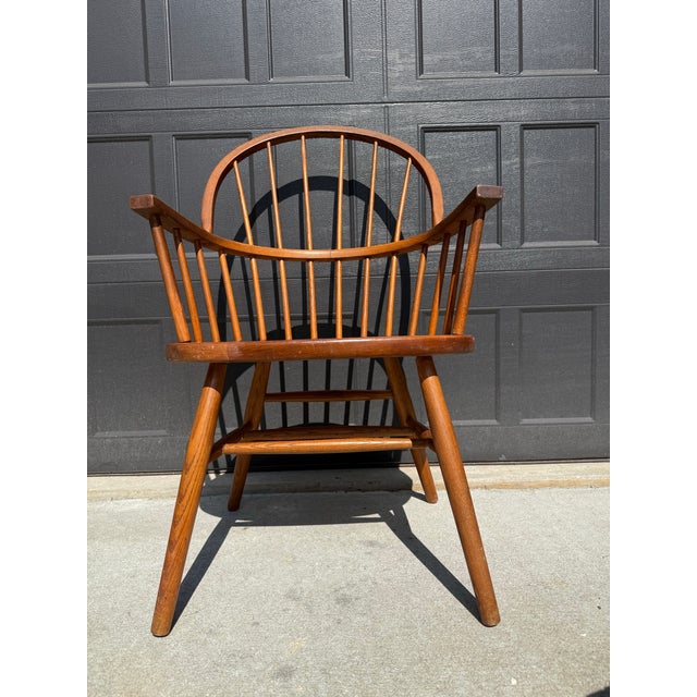 Beautiful vintage solid wood Windsor-style armchair by Nichols & Stone from the Skowhegan collection. Features a...