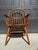 Beautiful vintage solid wood Windsor-style armchair by Nichols & Stone from the Skowhegan collection. Features a...