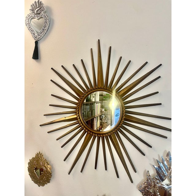 Rare vintage sunburst mirror signed Chaty Vallauris, made in France during the 1950s–1960s. with a diameter of 50 cm, this...