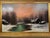 A captivating winter landscape by Nils Hans Christiansen, depicting a peaceful snow-covered village at dusk with a winding...