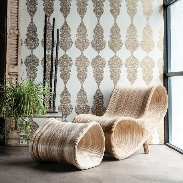 Brand new. Not vintage. The hardened rattan construction of the Parabola Furniture Collection creates a sense of gentle...