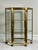 1970s high-quality tabletop showcase vitrine with three tiers behind a single hinged door with knob. This sleek, well-made...