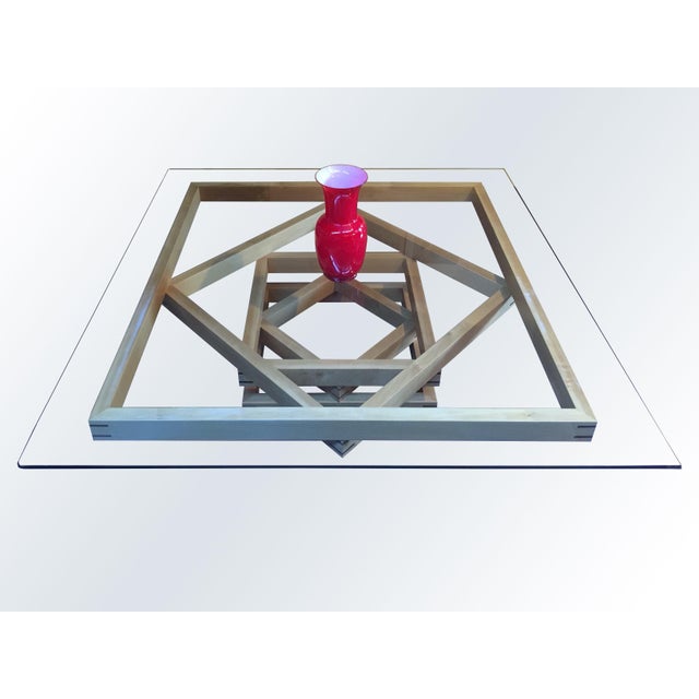 Corinto Coffee Table by Ferdinando Meccani. Designed in 1978, this beautiful maple coffee table with walnut inlays is...