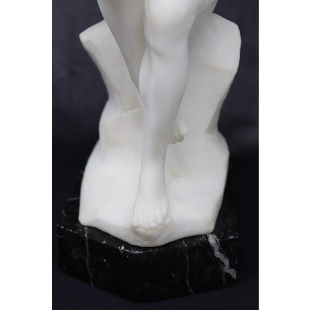 This sculpture is a striking example of early 20th-century Italian art, capturing the essence of the Art Deco period...