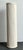 This vintage white painted rattan pedestal is a refined example of mid-20th-century design, characterized by its clean...
